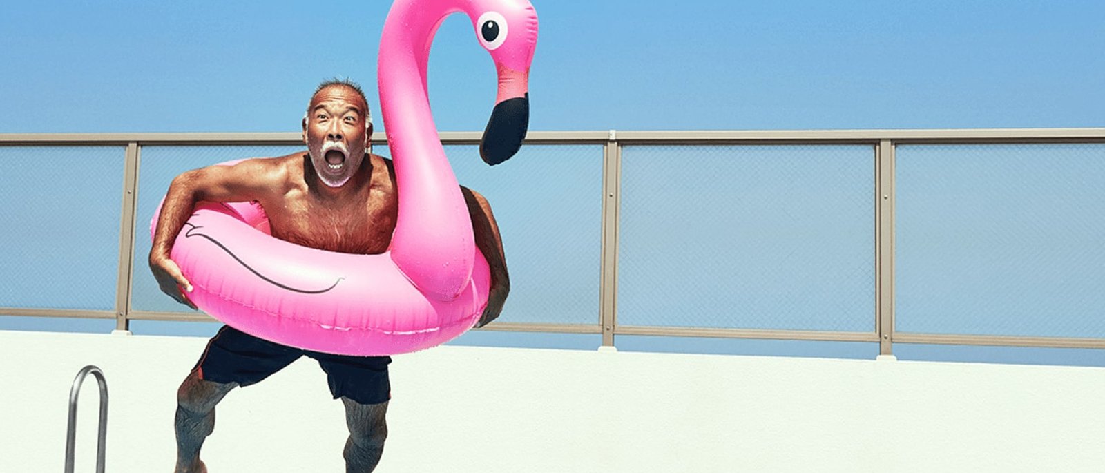 a person jumping into a pool