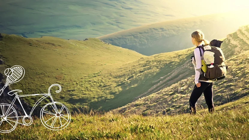 a woman walking on a hill