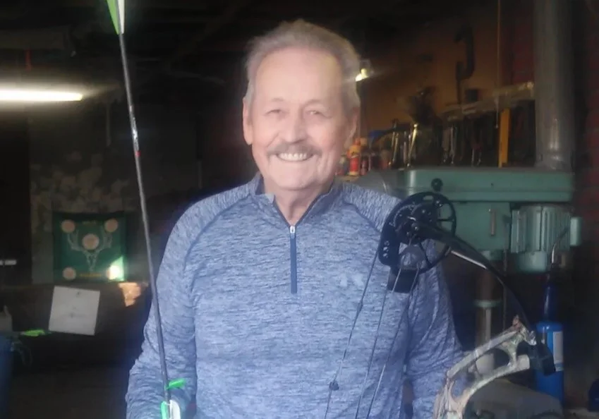 man living with an ostomy posing for photo