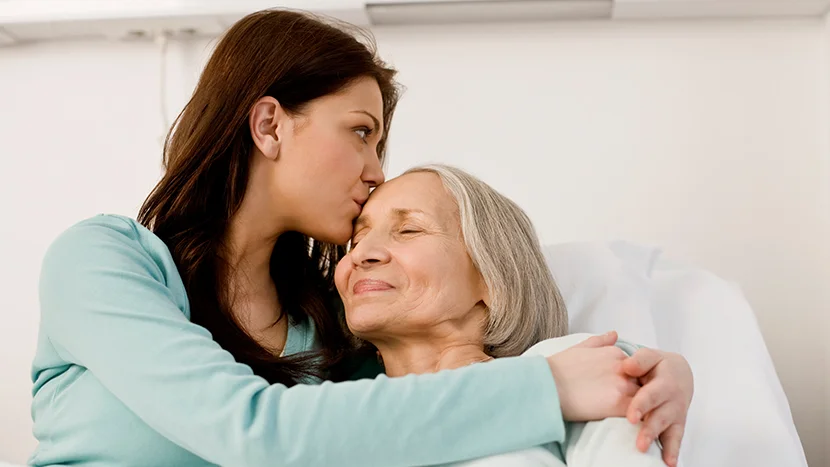 a woman embracing a woman